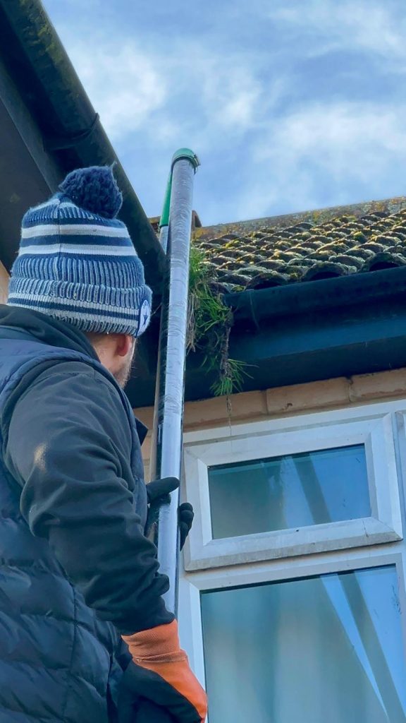 Gutter clearance using a high-reach vacuum system